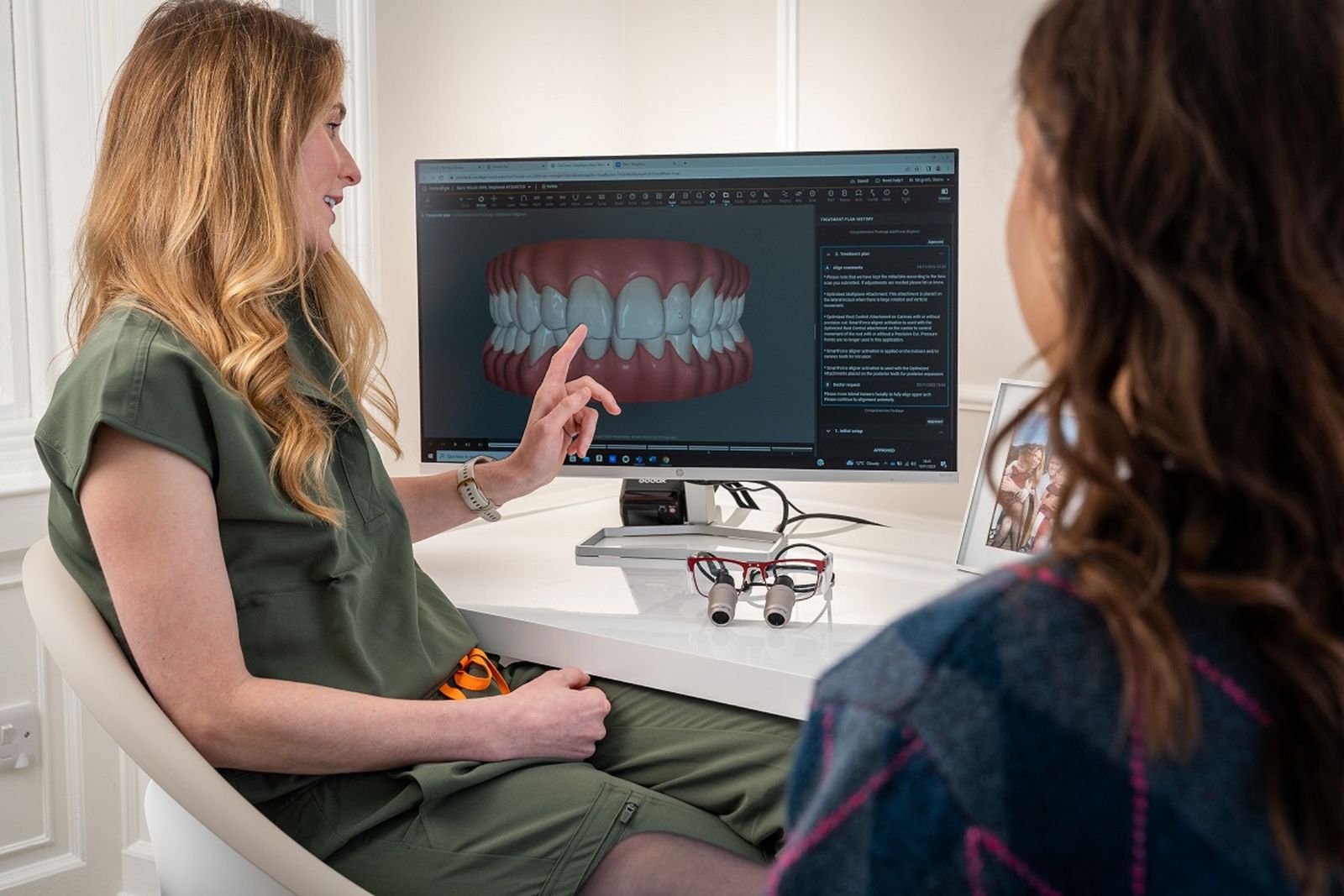 Dental consultation with a model display in a clinic setting